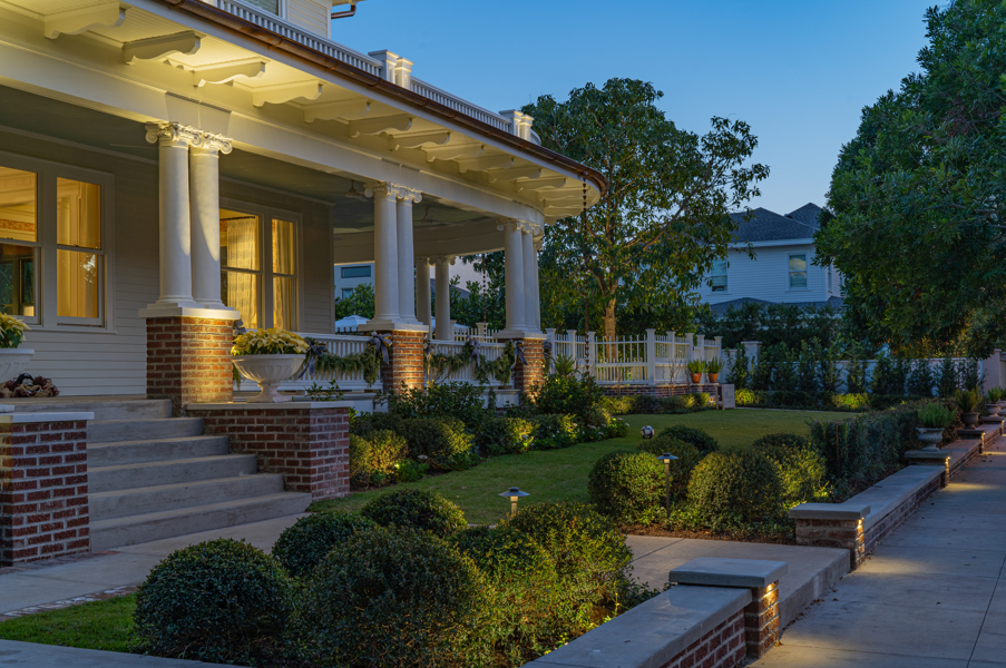 Historic porch and column lighting on a Texas home at blue hour