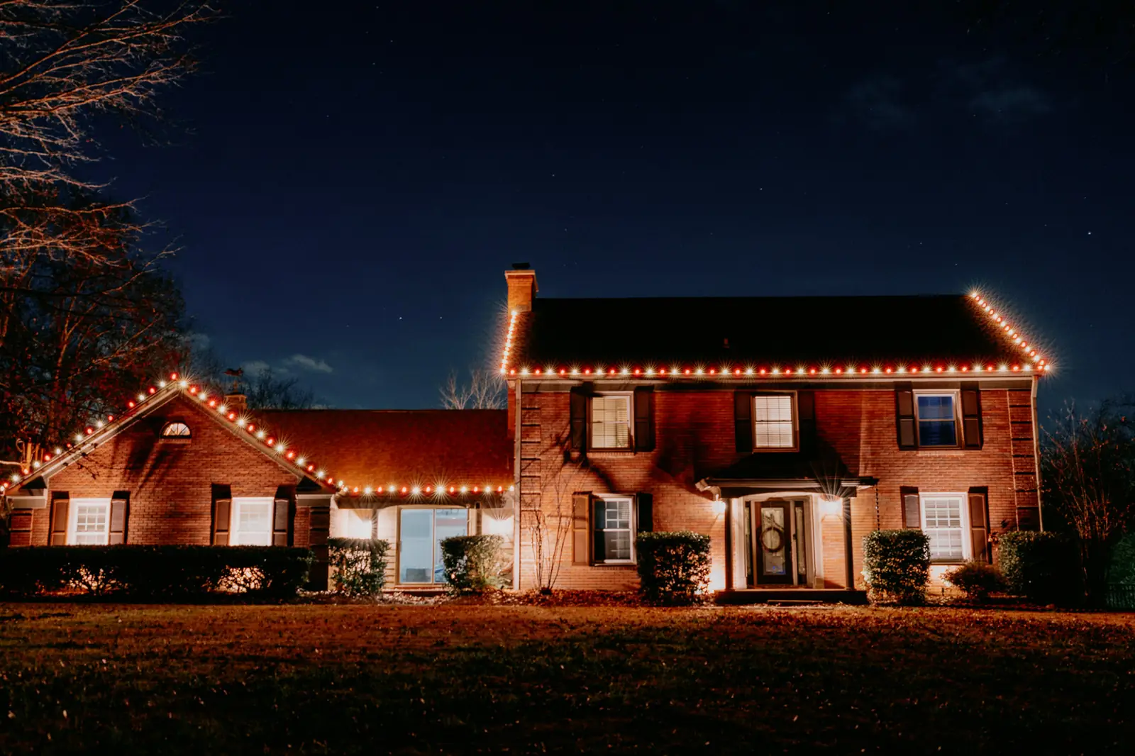 Christmas lights installed on a North Texas home roofline